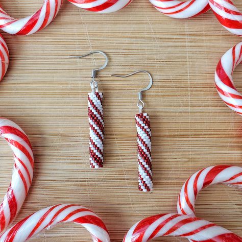 These are part of the Holiday Collection palette using white and red to create  the look of a peppermint stick. These beaded beauties are handmade with love and size 15/0 glass seed beads woven by hand one bead at a time. They measure approximately 2" long (from the top of the ear wire) and .25" wide. They are extremely lightweight and should not pull on your ear as you wear them. This is currently a Made to Order item and may take up to 2 weeks to create before shipping. I will send a message w Beaded Candy Cane Earrings, Beaded Holiday Earrings, Crafts With Seed Beads, Christmas Beaded Earrings Free Pattern, Seed Bead Projects Ideas, Christmas Fringe Earrings, Diy Holiday Earrings, Bead Pattern Ideas, Seed Beads Ideas