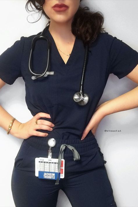 Medical Student wearing navy blue scrubs with a MDF Instruments ProCardial Titanium Stethoscope Black + Metalika around her neck. Red lipstick and hands on hips. Best Stethoscope, Best Gifts For Nurses, Nurse Outfit Scrubs, Stethoscope Case, Medical Scrubs Fashion, Tuning Forks, Medical Scrubs Outfit, Scrub Style, Nurse Inspiration