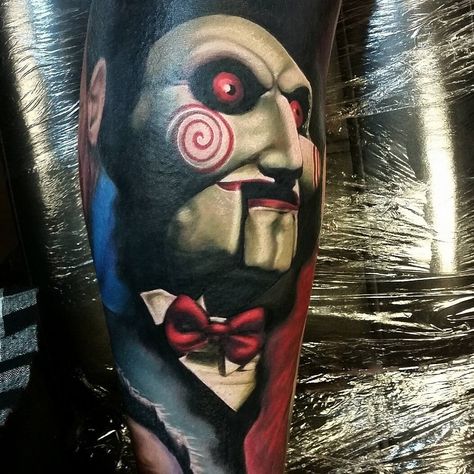 Tattoo artist Alex Wright color realistic horror tattoo Saw Tattoo, Horror Movie Tattoos, Gamer Tattoos, Clown Tattoo, Movie Tattoo, Movie Tattoos, Marvel Tattoos, Wicked Tattoos, Handpoke Tattoo