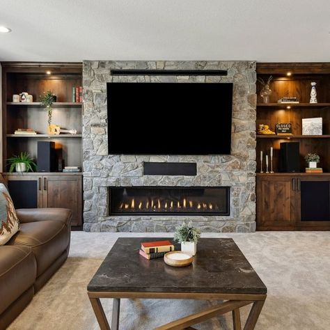 FBC Remodel | Design. Collaborate. Build Joy. on Instagram: "This Minneapolis basement is tailor-made for winter hibernation, from the warm woodwork to the cozy fireplace to the spacious bar!   #minneapolisbasementremodel #homeremodeling #basement #basementremodel #basementdesign #fbcremodel" Basement Fireplace Ideas With Tv, Basement Fireplace With Tv, Winter Hibernation, House Basement, Basement Fireplace, Basement House, Cozy Fireplace, Basement Design, Basement Remodeling