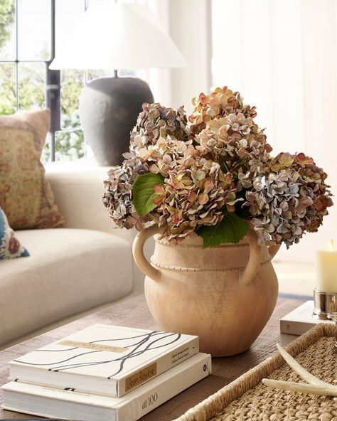 Easily transform your home into an autumnal escape with faux botanicals. They allow for unlimited creativity in crafting the perfect arrangement, are versatile, and require minimal maintenance to stay at their prime! Swipe for inspiration and tap to shop. Dried Hydrangeas Centerpiece, Dry Hydrangea Arrangements, Pottery Barn Fall Decor, Pottery Barn Fall, Front Door Baskets, Fall Hydrangea, Mohair Throw, Hydrangea Arrangements, Dried Hydrangeas