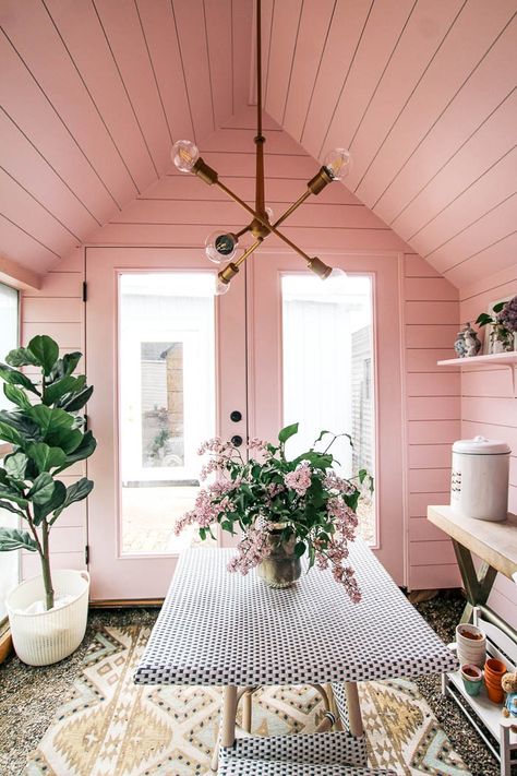 she shed shiplap and chandelier. Ready for some before and after photos of my small greenhouse woman cave?! The interior has lots of DIY ideas on a budget. The decor is shabby chic meets modern. It's painted pink with brass details and French bistro table and chairs. Get lots of decor inspiration for your backyard shed! Modern She Shed Interior, 8x10 She Shed Interior, Hangout Room Ideas Woman Cave, Pink Shiplap, Pink Shed, Shed Conversion Ideas, She Shed Interior Ideas, She Shed Decorating Ideas, She Shed Interior