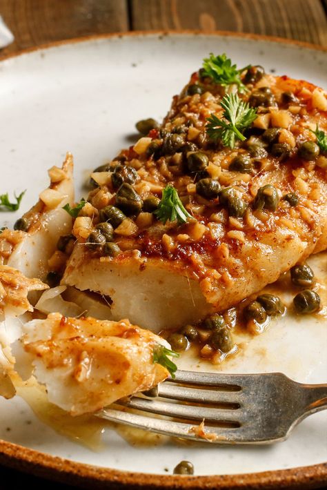 Seared Halibut With Anchovies, Capers And Garlic Recipe - NYT Cooking Caper Vinaigrette, Seared Halibut, Roasted Halibut, Halibut Recipes, Baked Fish Recipes, Garlic Recipe, Nyt Cooking, Garlic Recipes, Baked Fish