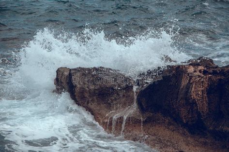 Water splashes. Waves in the sea hit the rocks on the shore royalty free stock photo Natural Wallpaper, About Water, The Rock, Free Stock Photos, Rocky, The Sea, Royalty Free Stock Photos, Royalty, Royalty Free