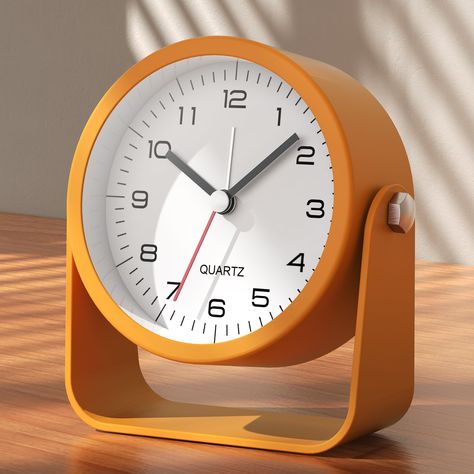 PRICES MAY VARY. 【Compact & Versatile】This charming analog alarm clock, measuring 3.5 x 1.4 x 3.9 inches, is perfect for any space from bedrooms to office desks. Its petite size and durable metal construction make it ideal for home and travel alike. 【Adjustable Viewing Angle】Easily customize the angle of the desk clock face for optimal viewing, whether it is placed on a table, bedside, or bathroom shelf. 【Premium Design】 Crafted from sturdy metal with a sleek finish, this cute desk clock not onl Room Decor Orange, Living Room Decor Orange, Kids Living Room, Analog Alarm Clock, Cute Table, Bedside Clock, Small Clock, Small Bedside, Travel Alarm Clock