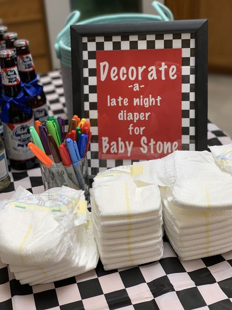 Decorating a diaper with some words of encouragement for the mom & dad to be, help but a smile on their face when they experience some not so fun baby bodily explosions 😂 Black And White Checkered Baby Shower Ideas, Skateboard Baby Shower Ideas, Vans Baby Shower Theme, Baby Shower Motorcycle, Rock Baby Showers, Announcement Pictures, Racing Baby, Diaper Party, Classy Baby Shower