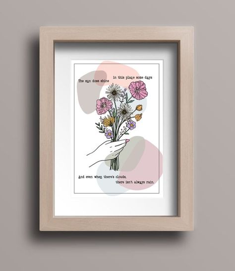 Framed print, with an illustrated hand drawn line art of hand holding wildflowers. Typewriter text reading "The sun does shine in this place some days, and even when there's clouds, there isn't always rain." Frightened Rabbit, Flowers Line Art, Flower Line Art, Line Art Print, Lyric Prints, I Feel Good, Amazing Flowers, All Print, Feel Better