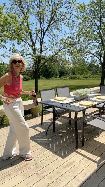 Candace Leslie Cima on Instagram: "Having friends over for dinner on the deck! A little wine a lot of food and laughter is a wonderful way to spend a summer evening. Sometimes you just want to be completely happy and feel the moment.. Life is not always easy so when you have one of those moments when your heart is light and everything feels right cherish it! ⁠ Flip Flops by Clarks and Gina Top both available in my Amazon Store @www.amazon.com/shop/styleinyour70s.withleslieb⁠. Pink Top is out of Candace Leslie Cima, Friends Over For Dinner, Gina Top, A Lot Of Food, Having Friends, Amazon Store, Summer Evening, Pink Top, Pink Tops