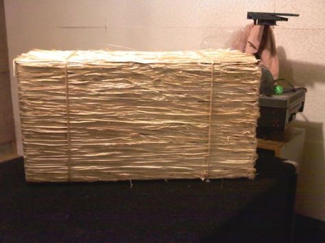 Here's an idea - fake hay bales made from cardboard box.  This one coated in rafia (about 5-6 packages from Dollar Store), glue-gunned on.  Also suggest strips of paper, glued on, painted to look like straw.  Whole thing folds up for storage (like a cardboard box).: Wicker, Hamper, Vbs Ideas Tips, Storage Basket, Basket, Hay Bale, Laundry, Laundry Basket, Storage Hay Seating, Barnyard Vbs, Farm Vbs, Prop Building, Play Props, Wild West Party, Western Theme Party, Western Party, Christmas Program