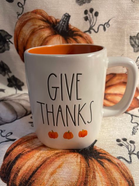 Rae Dunn Give Thanks Orange Inside with Black Lettering and Pumpkin Images Rae Dunn Fall, Random Products, Pumpkin Images, Fall Mug, Rae Dunn Collection, Boo Basket, Orange Interior, Watercolor Pumpkins, Cute Watercolor