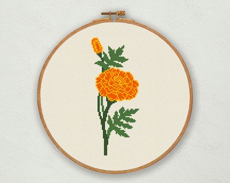 Marigold cross stitch pattern. Birth Month Flower - October This pattern is an instant download PDF. ● Fabric: Aida 14 count. You can use other fabrics too, like aida 16 or 18 count. ● DMC Colors: 4 ● Design size: 45 stitches wide x 111 stitches high. ● Finished size (on 14 count): 3.21 x 7.93 inches // 8.16 x 20.14 cm ● In the pictures, the fabric is represented in beige, light beige and white color. Digital download pattern includes: - Digital reproduction of the finished embroidery. - Color a Embroidery Marigold, Marigold Cross Stitch, Marigold Embroidery, Marigold Decor, Cross Stitch Fall, October Birth Flower, October Birth Flowers, Flower Cross Stitch, Fall Mums