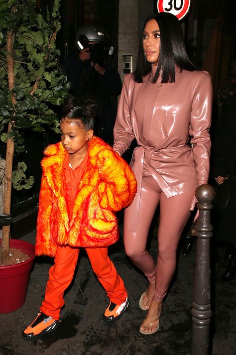 North West wears a head-to-toe orange outfit including Adidas Yeezy Boost 700 MNVN "Orange" sneakers with mom Kim Kardashian in a Balmain latex outfit and Yeezy Season 8 sandals in Paris. #kimkardashian #northwest #celebrityfashion #yeezy #streetstyle Yeezy 700 Mnvn Outfit, North West Outfits, North West Kardashian, Outfit In Paris, Baddie Stuff, Kim Kardashian And North, Jenner Kids, Kim Kardashian Outfits, Kid Swag