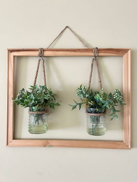 Create a living wall art piece by framing a piece of mesh or wood and attaching small plants like air plants or moss. This unique display can serve as a focal point in any room. Wall Plants Indoor, Living Wall Indoor, Diy Hanging Planter, Living Wall Art, Wood Slat Wall, Deco Studio, Diy Wall Art Decor, Plant Decor Indoor, Plant Vase