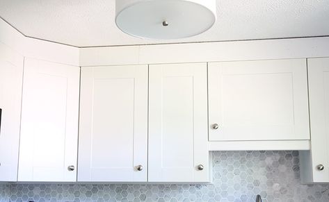 How to Install a Crown Molding to Kitchen Cabinets | JustAGirlAndHerBlog.com Crown Moulding Kitchen Cabinets, Kitchen Cabinet Molding, Crown Molding Kitchen, Ikea Cupboards, Kitchen Cabinet Crown Molding, Cabinets With Crown Molding, Installing Kitchen Cabinets, Cabinet Molding, Above Cabinets