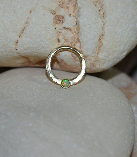 ⋙ 14kt Gold Filled kiwi green opal septum ring. ⋙ This listing is for one earring. ⋙ This ring is made of 16 gauge wire. ⋙ Available interior (inner) diameters: 8mm; 9mm; 10mm; 11mm; 12mm ⋙ Available gemstones: ruby; lapis lazuli; black onyx; emerald; light blue opal; garnet; white opal; kiwi green opal; amethyst; aqua blue cz; clear cz; black-red opal; turquoise; blue sapphire ⋙ Measurements: ⋙ The stone is 2mm in diameter ⋙  ⋙ I will put your order into a beautiful jewelry box (it will be read Bijoux Piercing Septum, Cute Septum Rings, Septum Jewelry Clicker, Gold Septum Ring, Tragus Earrings Hoop, Opal Septum, Gold Septum, Septum Piercing Jewelry, Septum Hoop