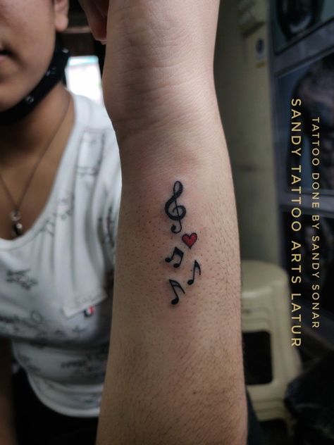 Music Notes Hand Tattoo, Women Music Tattoos, Small Musical Note Tattoo, Tattoo Idea For Music Lover, Music Friendship Tattoos, Musical Note Tattoo Behind Ear, Music Note Hand Tattoos, Music Note With Wings Tattoo, Thigh Music Tattoos Women