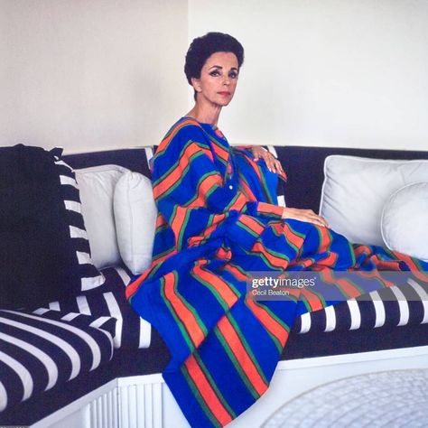 Gloria Guinness wearing a Mexican striped djellaba with white button down #GloriaGuiness #stripe #pjg Striped Couch, Cotton Caftan, Ladies Who Lunch, Cecil Beaton, Diana Vreeland, Velvet Slippers, Cotton Midi Dress, Elizabeth Taylor, Kaftan Dress