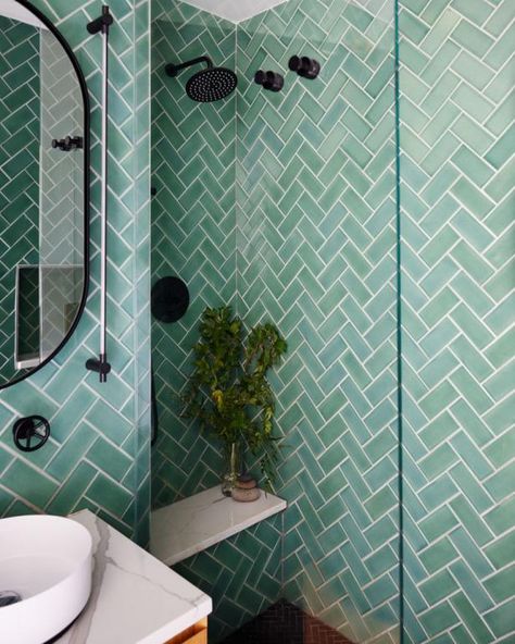 Chevron Tiled Bathroom With Blue, Green Hues Chevron Tile Bathroom, West Village Apartment, Tiled Bathroom, Chevron Tile, Serene Bathroom, Colorful Bedding, New York City Apartment, Pink Sofa, Home Needs