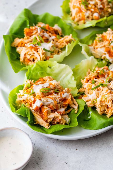 This easy-to-make buffalo chicken salad is packed with fresh veggies, lean protein and simple toppings like blue cheese. Buffalo Chicken Salad Wrap, Buffalo Chicken Lettuce Boats, Low Carb Buffalo Chicken Wraps, Buffalo Chicken Healthy Recipes, Buffalo Chicken Salad Healthy, Butter Lettuce Recipes, Buffalo Chicken Healthy, Healthy Salad With Chicken, Buffalo Salad