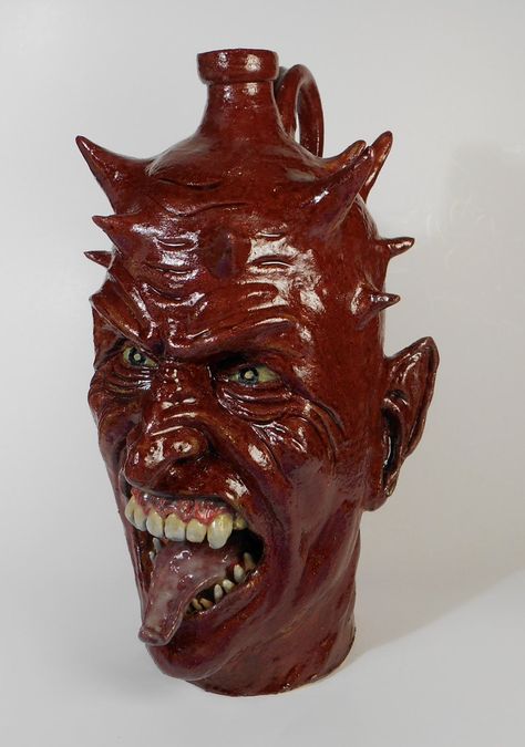 Red Devil face jug by Pennsylvania potter Jay Vonderhey Creepy Ceramics, Face Jugs Pottery, Anime Pottery, Weird Clay Art, Devil Face, Ceramic Cafe, Face Jugs, Colonial Times, Monster Face