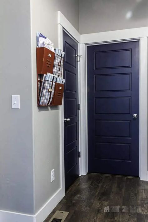 If you don't want to go with dark gray or black for your door color, you could try something with slightly more color - like navy blue! Navy Interior Doors, Paint Interior Doors, Interior Doors Black, Painting Interior Doors, Blue Painted Door, Painting Interior Doors Black, Blue Interior Doors, Wagner Paint Sprayer, Cardboard Picture Frames