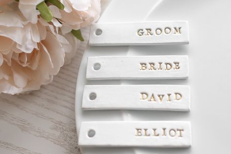 Wedding Name Place Settings and Favours for Rustic wedding table décor. Personalised Clay gift tags Diy Clay Name Tags, Clay Place Names, Clay Name Tags, Gold Themed Wedding, Name Place Settings, Wedding Name Tags, Clay Gift Tags, Rustic Wedding Table Decor, Wedding Place Names