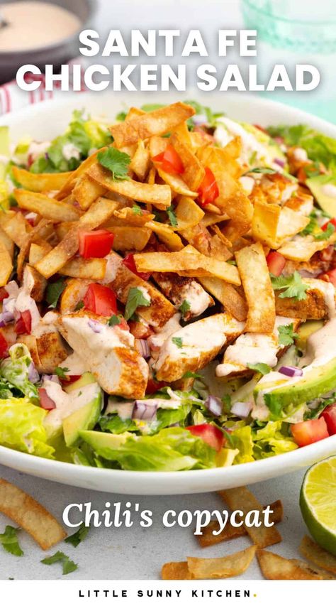 Santa Fe Chicken Salad is a Chili's copycat recipe, with spicy chicken, crispy tortilla strips, and fresh veggies like tomatoes and avocado. Chicken Tortilla Salad, Santa Fe Salad Dressing Recipes, Chicken Salad Recipe Lettuce, Fiesta Chicken Salad Recipe, Copycat Restaurant Salads, Santa Fe Salad Cheesecake Factory, Costa Vida Salad Copycat, Applebees Santa Fe Chicken Salad, Santa Fe Chicken Salad Dressing