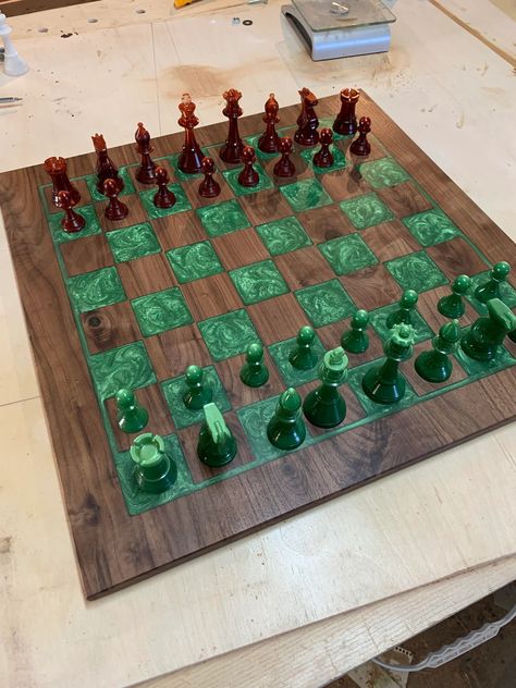 Cut from dark walnut, inlaid with pigmented epoxy resin. Pieces are 3d printed using a resin printer. Project by damantea on Reddit Epoxy Resin Chessboard, Epoxy Resin Board Games, Wood And Epoxy Chess Board, Wood And Resin Chess Board, Epoxy Resin Chess Board, Resin Printer Projects, 3d Resin Printer Projects, Epoxy Resin Crafts Ideas, Epoxy Chess Board