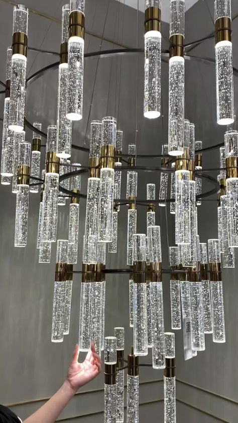 This Oversized Modern Luxury 4-tiered Bubble Crystal Icicle Chandelier is designed for high-ceiling foyers, hallways, and staircases. Its four-tiered design combines clear crystal, bubble crystal, icicle crystal, and a gold finish for a stunning look. Expertly crafted, this designer-recommended fixture provides both creative style and illumination. Voltage 110V-120V/ 220V-240V Material Crystals, Metal Wire Length Adjustable Light Source LED Bulb Included Or Not Yes Dimmable Yes Sloped Ceiling Ad Icicle Chandelier, High Ceiling Foyer, Hallway Staircase, Pretty Christmas Decorations, Foyer Hallway, Jewelry Store Design, Elegant Lighting Fixtures, Bubble Chandelier, Modern Crystal Chandelier