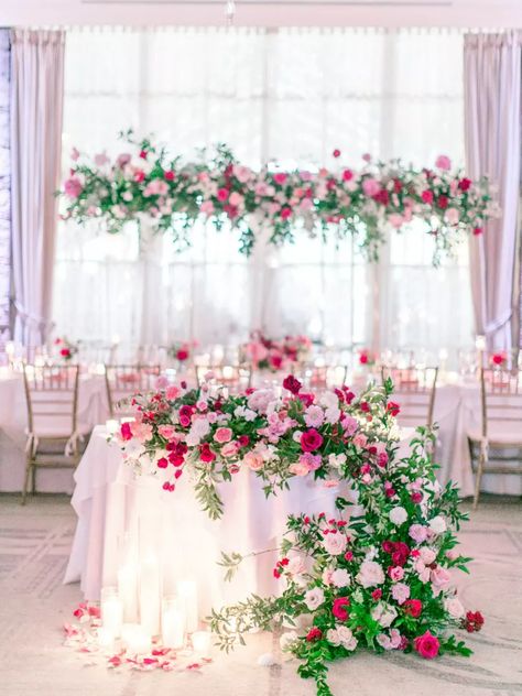 Romantic Pink Sweetheart Table with Cascading Rose Arrangement Pink Sweetheart Table, Hanging Flowers Wedding, Sweetheart Table Flowers, Aesthetic Country, Pink Flower Arrangements, Pink Centerpieces, Sweetheart Table Decor, Club Aesthetic, Wedding Arch Flowers