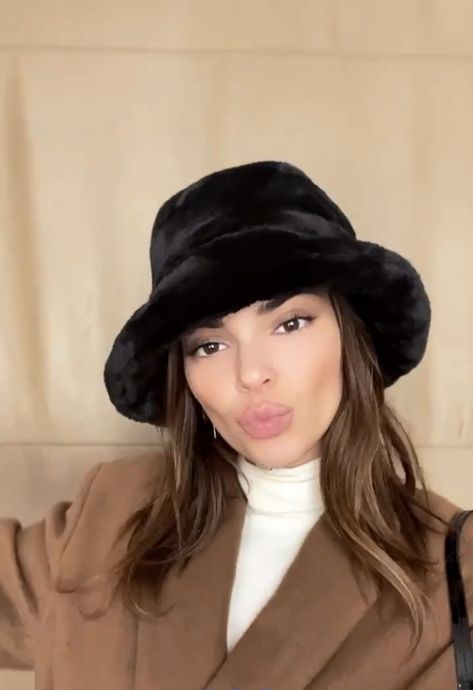 kendall jenner in black fuzzy bucket hat Faux Bucket Hat Outfit, Black Fuzzy Bucket Hat Outfit, Black Fur Bucket Hat, Puffy Hat Outfit, Black Fur Bucket Hat Outfit, Kendall Jenner Bucket Hat, Fuzzy Bucket Hat Outfit Winter, Black Bucket Hat Outfit Winter, House Of Sunny Cardigan Outfit