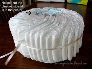 How+to+Make+a+Diaper+Cake+without+Rolling | carefully remove the entire layer of diapers don t worry the string ... Diaper Cake Tutorial, Diaper Cakes Tutorial, Diaper Cake Instructions, Diy Diaper Cake, Baby Shower Wreath, Bean Sprout, Nappy Cake, Diaper Cake Boy