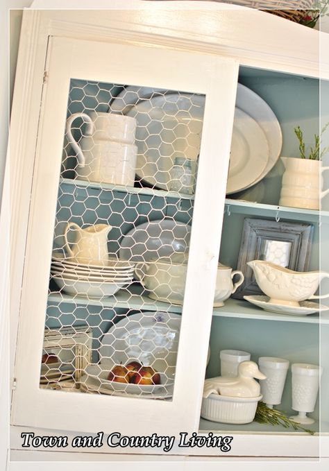 Recently our cat broke the stenciled glass in the china cabinet. Rather than get upset, I took the opportunity to swap out the broken glass with chicken wire an… Linen Hutch, Chicken Wire Cabinets, Farmhouse Mugs, Cabinet Fronts, Chicken Diy, Design Room, Diy Kitchen Cabinets, Chicken Wire, Farmhouse Furniture