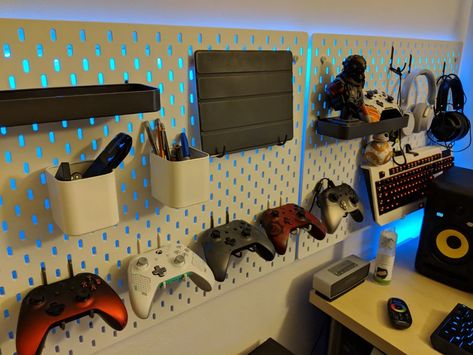 Gaming Room Pegboard, Remote Wall Holder, Industrial Gamer Room, Led Behind Pegboard, Ikea Pegboard Gaming Setup, Gamer Room Organization, Pegboard Game Room, Peg Board In Bedroom, Ikea Wall Pegboard