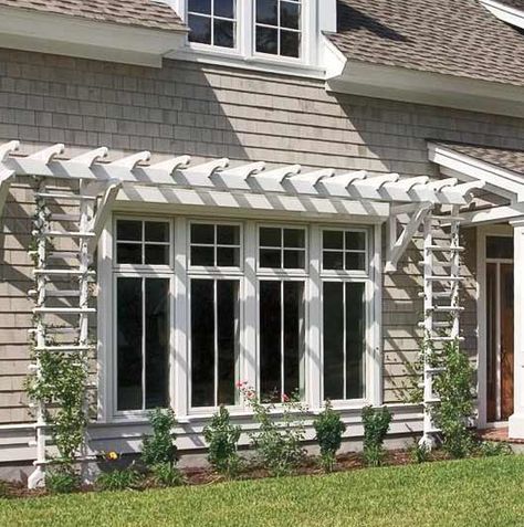 A shallow pergola and trellises give definition to this wall of windows by Marvin. Window Arbor, Window Pergolas, Window Trellises, French Casement Windows, Garage Pergola, Cheap Pergola, Casa Patio, Window Awnings, Windows Exterior