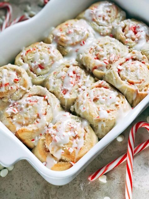 These Peppermint White Chocolate Sweet Rolls are a delicious homemade cinnamon roll that makes a perfect Christmas morning breakfast recipe. Packed with candy canes and cream. Also great for holiday brunch or dessert. Can be made as overnight cinnamon rolls. #christmasbreakfast #cinnamonrolls #peppermintrecipes #christmasrecipes Peppermint Recipes Desserts, Yule Recipes, Peppermint White Chocolate, Peppermint Dessert, Morning Recipes Breakfast, Cinnamon Roll Recipes, Peppermint Recipes, Sweet Roll Recipe, Peppermint White