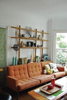 We have a big expanse of wall behind the couch in our living room that I’m not quite sure what to do with. I love the idea of this shelving unit – its narrow enough to not take up room, but could be rearranged frequently. (Of course, looking at this makes me want a new … Shelving Behind Couch, Living Room Interior Design Cozy, Wall Behind The Couch, Behind Couch Decor, Furniture Placement Living Room, Behind The Couch, Dream House Living Room, Grey Couch Living Room, Reading Corners