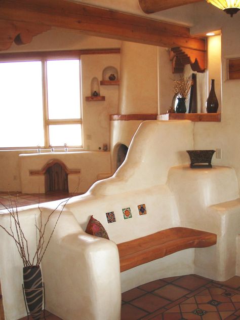 Southwestern style - I love the finish on the walls and bench/room divider and the kiva in the corner Southwest Style Home, Spanish Style Decor, Casa Hobbit, Adobe Home, Earthship Home, Mud House, Adobe House, Casas Coloniales, Cob House