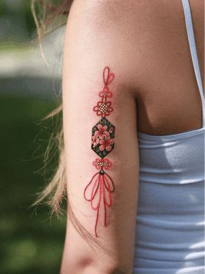 Cherry Blossom Tattoos: The Legend of Sakura | Tattoodo Norigae Tattoo, Korean Tattoo Artist, Sakura Tattoo, Red Cherry Blossom, Korean Tattoos, Geometric Tattoo Arm, Knot Tattoo, Fusion Ink, Blossom Tattoo