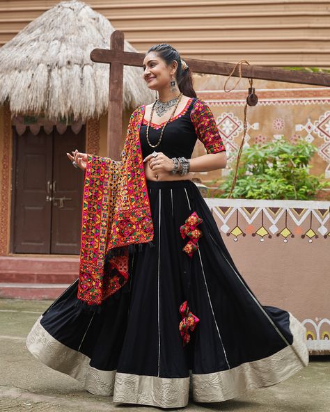 Celebrate Navratri style Rich black color with embroidery & mirror work and viscose rayon dupatta 🖤✨ SHOP NOW 🛍️ gotifab.com [lehengacholi, garba outfits, navratri lehengas, navratri collection,navratri chaniya choli,navratri collection ] #lehengacholi #navratrilehenga #navratricollection #navratri #navratrichaniyacholi #garbaoutfit Garba Outfit, Chaniya Choli Designs, Navratri Lehenga, Mirror Work Lehenga, Mirror Work Blouse, Bridesmaid Saree, Black Lehenga, Navratri Chaniya Choli, Party Sarees