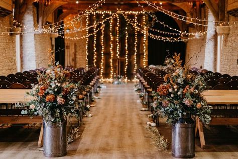 The Tythe Barn wedding ceremony room with fairy lights, milk churn florals and rustic wedding decor. Autumn Wedding Aisle, Wedding With Fairy Lights, Barn Rustic Wedding, Sage Green Bridesmaid Dresses, Sage Green Bridesmaid, Autumn Wedding Inspiration, Fall Barn Wedding, Wedding Ceiling, Wedding Isles