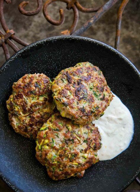 Spicy Turkey and Zucchini Burger ~ Turkey burger patties with grated zucchini, herbs, cumin, and cayenne, served with lemony sour cream sauce. ~ SimplyRecipes.com #middleeastern #gluten-free #lowcarb #burger Cilantro Seasoning, Turkey Burger Patties, Shredded Zucchini Recipes, Turkey And Zucchini, Zucchini Burger Recipe, Zucchini Burgers, Turkey Ground, Turkey Zucchini, Zucchini Burger