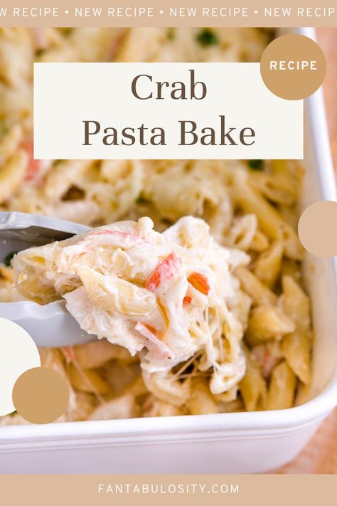 Tongs holding up a serving of baked crab Alfredo pasta. Crab Rangoon Pasta, Crab Spaghetti Recipes, Fake Crab Meat Recipes Dinners, Canned Crab Meat Recipes Pasta, Nanas Crab Rollups 12 Tomatoes, Crab Alfredo Pasta, Artificial Crab Meat Recipes Dinners, Crab Pasta Bake, Imitated Crab Pasta Recipes