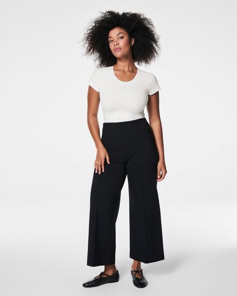 This smoothing pant comes in our premium ponte fabric with targeted compression built in, powered by SPANX CoreSure Tech™. With comfortable 4-way stretch and a high rise waist, this cropped wide leg pant will have you feeling smooth from tummy to thigh, and oh-so-comfortable throughout the wide leg. No zippers, no buttons, and no pockets (so no bulk!) at the hips—all for the ultimate smoothing effect. | Spanx Women's SPANXsmooth PerfectFit Ponte Cropped Wide Leg Pant Cropped Wide Leg Pants, Outfits Petite, Ponte Fabric, Apple Shaped, Wide Leg Pant, Wide Leg Pants, Casual Pants, Built In, Wide Leg