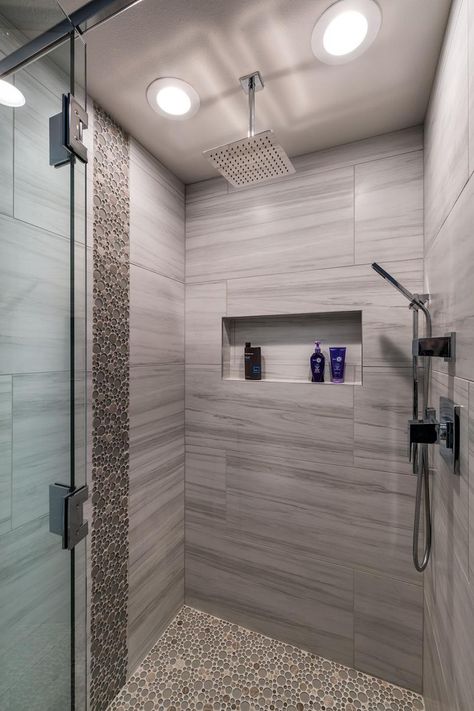 Round tiles give a pebbled look and feel to this stylish walk-in shower with a luxurious waterfall shower head. Modern Shower Design, Modern Shower Room, Design Tiles, Bathroom Shower Design, Waterfall Shower, Shower Bathroom, Bathroom Shower Tile, Bathroom Tile Designs, Shower Tile Designs