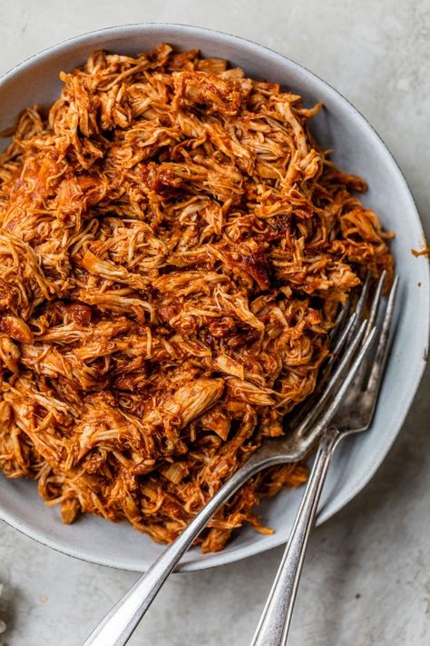 Slow Cooker BBQ Chicken is incredibly flavorful and guaranteed to be a family favorite! This shredded chicken recipe is chicken breasts simmered in the Crockpot with a tasty homemade BBQ sauce until tender. Shred the chicken, then serve it piled on toasted buns with coleslaw, over a salad, stuffed in a baked potato or in a lettuce wrap. The options are endless! Sweet Potato Bbq, Shredded Chicken Recipe, Paleo Barbecue Sauce, Slow Cooker Shredded Chicken, Shredded Bbq Chicken, Slow Cooker Bbq Chicken, Bbq Sauce Chicken, Homemade Bbq Sauce, Clean And Delicious