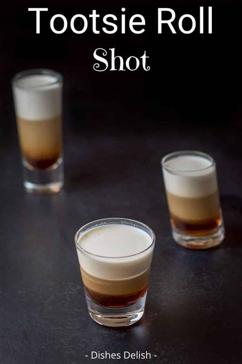 Its dense, double-chocolate flavor earned the tootsie roll shot the same name as the candy. Taste for yourself!  There are only three ingredients to this scrumptious shot! #tootsierollshot #layeredshot #dishesdelish Tootsie Roll Shot, Alcohol Shots, Camping Drinks, Alcohol Beverages, Liquor Recipes, Liquor Shots, Mimosa Recipe, Cocktail Shots, Shots Alcohol