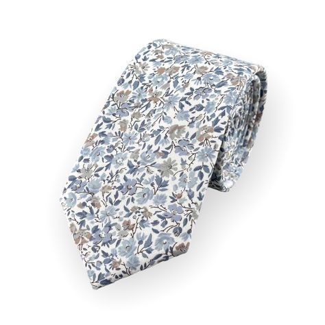 This Handcrafted Floral Tie Is Perfect For Adding Some Personality And Style Into Any Outfit. The White Base Provides A Clean And Classic Look, While The Delicate Floral Pattern In Shades Of Blue Adds A Touch Of Modern Sophistication. It’s An Excellent Accessory That Can Complement A Variety Of Wedding Styles Including Beach, Rustic And Desert Weddings. It's Also A Great Choice For Proms, Formal Dances, Graduation Ceremonies And Other Special Occasions. Fabric: 100% Cotton Style: Slim/Narrow Wid Desert Weddings, Floral Necktie, Groom Ties, Groomsman Gift, Designer Ties, Tie Gifts, Wedding Ties, Desert Wedding, Blue Floral Print