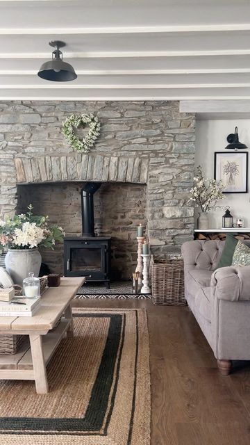 Dominique | Cwmrhys Cottage on Instagram: "Sunshine filled summer evenings ☀️✨ #livingroom #livingroomdecor #livingroomstyle #livingroomdesign #stonewall #featurewall #featurefireplace #interiordecor #interiordecorating #coffeetable #coffeetablestyling #roomstyle #roomstyling #shelfstyling #shelfie #comfycottagecharm #cosyhomestyle #cosycottage #cosyhome #cottageinterior #moderncountrystyle #moderncountryinteriors #countryhome #countryhomestyle #sittingroomdecor #loungedecor #homerenovation #h Cosy Living, Cottage Interior, Cosy Living Room, Cottage Interiors, Cottage Living, Living Room With Fireplace, Fireplace Design, Stone Fireplace, Fireplace Decor