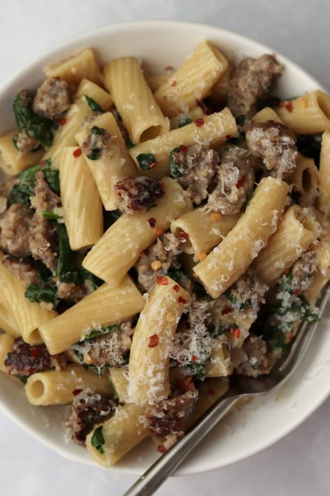 One Pot Spinach Sausage Pasta is the perfect balance of creamy, slightly spicy, and comforting. Cooking the pasta in the same pot with the other ingredients results in both more flavor but also easier clean up! Sausage And Spinach Pasta, Spinach Sausage Pasta, Super Bowl Finger Foods, Creamy Sausage Pasta, Spinach Sausage, Sausage Spinach Pasta, Spinach Pasta Recipes, Sausage And Spinach, Sausage Spinach